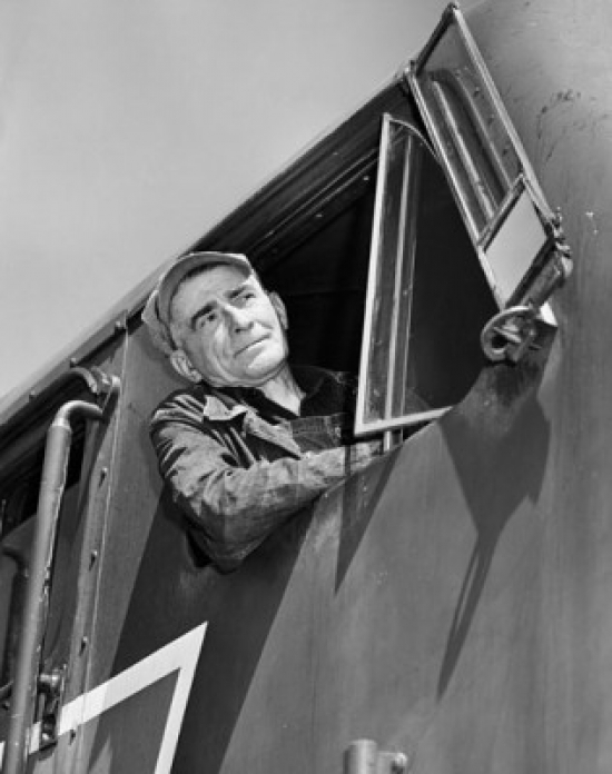 Train Conductor Leaning Out From an Engine Window Poster Print - 18 x 24 in.