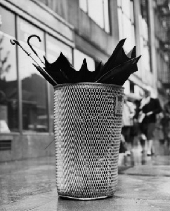 Two Umbrellas in a Garbage Can Poster Print - 18 x 24 in.