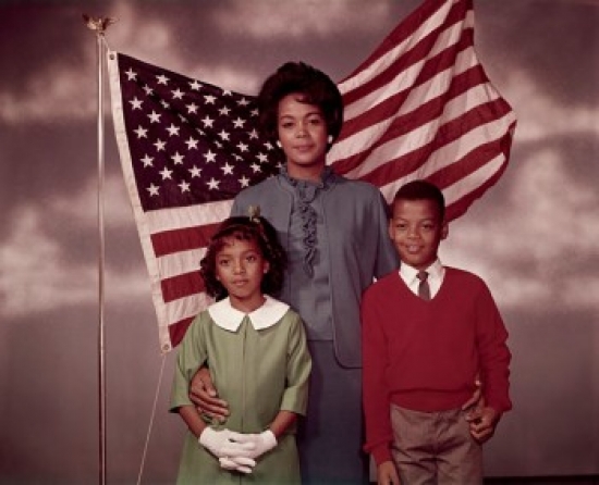 SAL3811361918A Family Standing in Front of an American Flag Poster Print - 18 x 24 in.