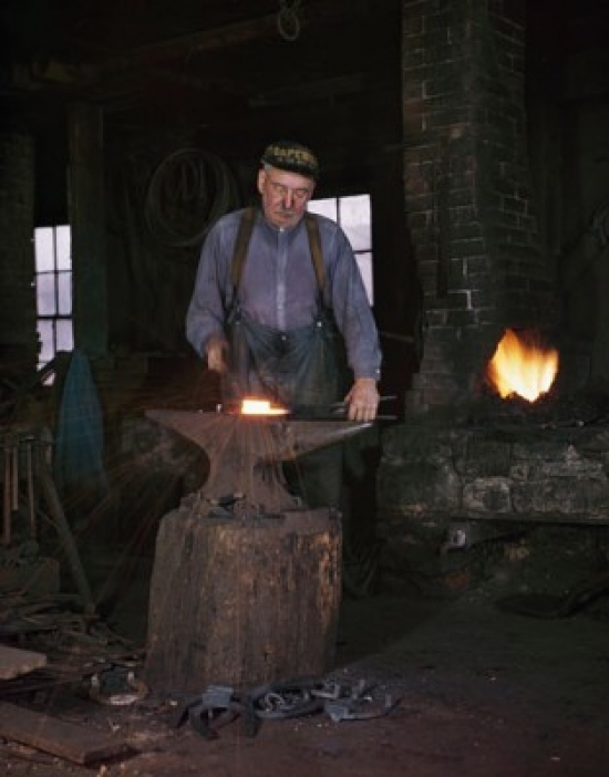 Blacksmith Working in a Workshop 1940 Poster Print - 18 x 24 in.