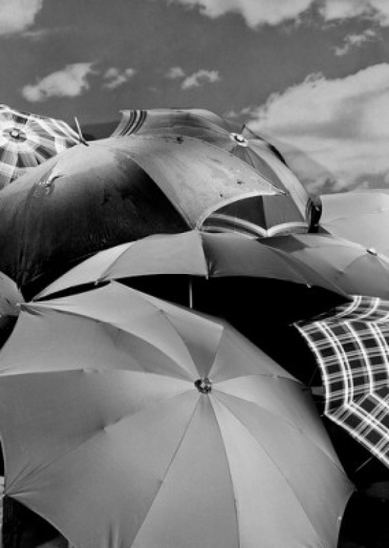 Several Umbrellas Stacked Together with Sky in Background Poster Print - 18 x 24 in.