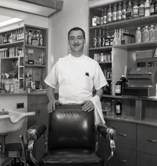 Barber Standing Behind Chair in Barber Shop Poster Print