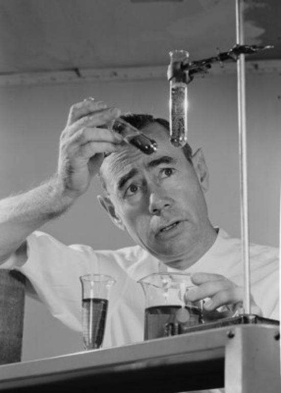 Scientist Conducting Experiment with Test Tubes Poster Print - 18 x 24 in.