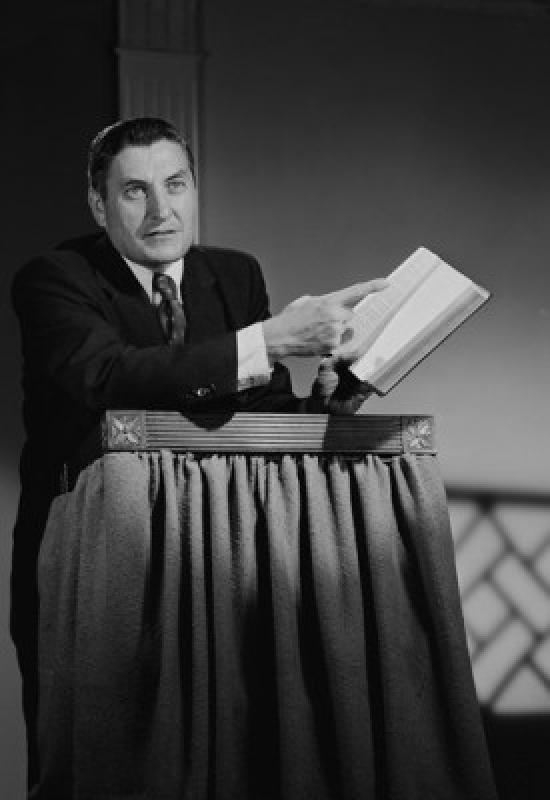 Preacher at Lectern Pointing at Book Poster Print - 18 x 24 in.