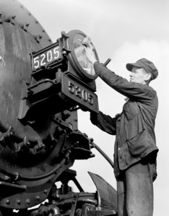 Male Worker Cleaning Train Headlight Poster Print - 18 x 24 in.