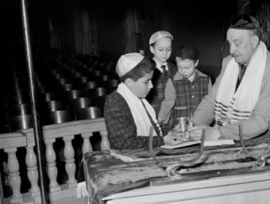 Man with Boys Praying in Synagogue Poster Print - 18 x 24 in.