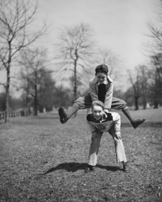 Two Boys Leapfrogging in Park Poster Print - 18 x 24 in.