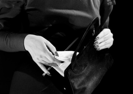 Woman Taking Tissue From Bag Poster Print - 18 x 24 in.
