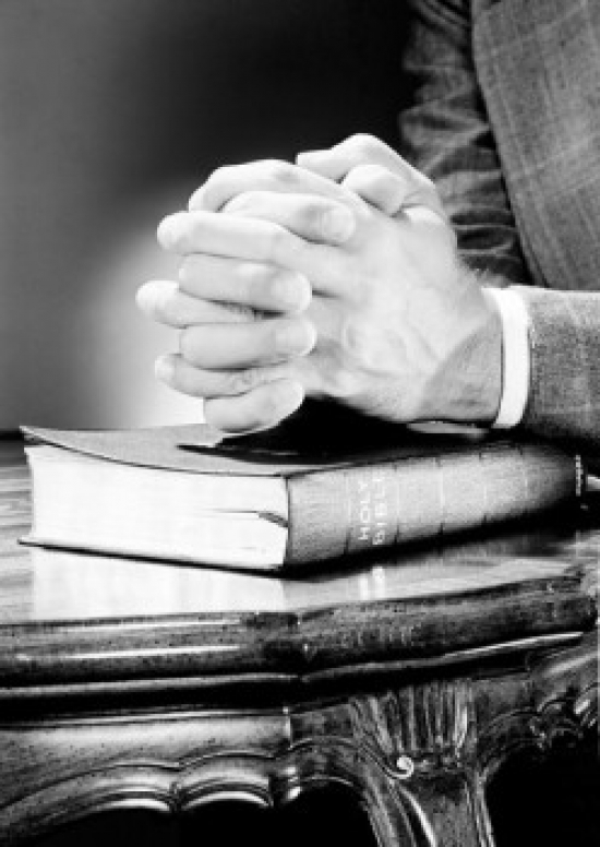Folded Hands on Top of Bible Poster Print - 18 x 24 in.
