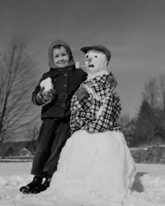 Boy Making Snowman Poster Print - 18 x 24 in.