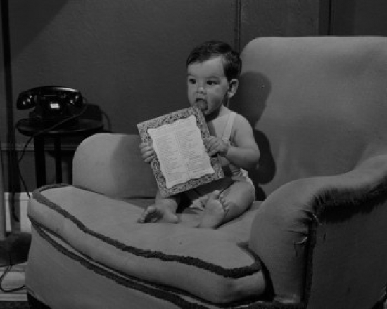 Baby Boy on Sofa Poster Print - 18 x 24 in.