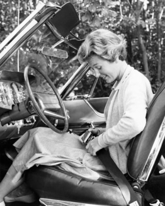 SAL25544599 Side Profile of a Young Woman Sitting in the Drivers Seat & Fastening the Seat Belt in a Car Poster Print - 18 x 24 in.