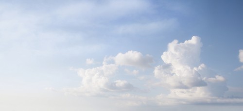 DPI12304720 Clouds in a Blue Sky - Toronto Ontario Canada Poster Print by Directedphoto, 22 x 10
