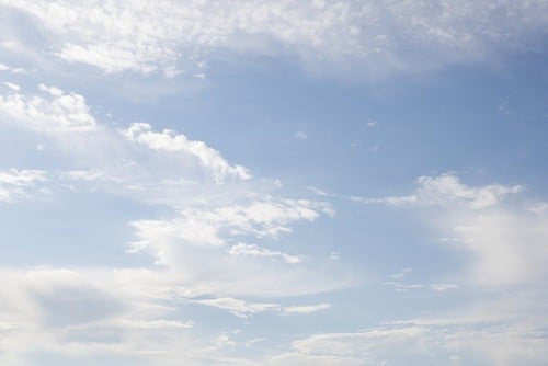 DPI12304721 Clouds in a Blue Sky - Toronto Ontario Canada Poster Print by Directedphoto, 19 x 12