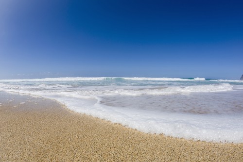 Water Washing Up On The Beach Barking Sands Polihale Beach On West Kauai Poster Print by Alvis Upitis - 19 x 12