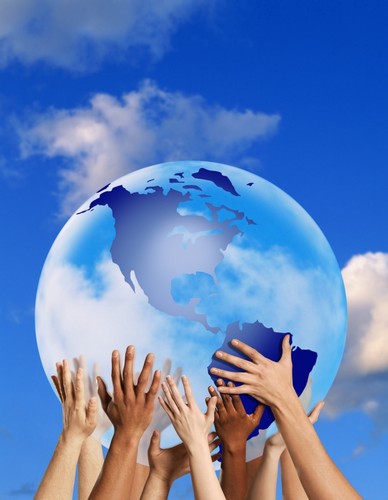 Hands Touching A Globe Poster Print by Don Hammond, 12 x 16