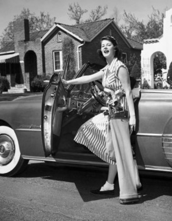 Young Woman Opening the Door of a Car Poster Print