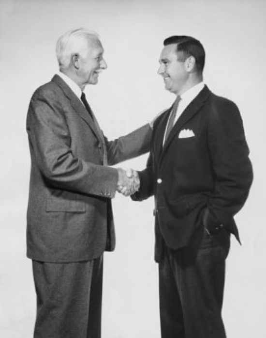 Two Businessmen Shaking Hands Poster Print - 18 x 24 in.