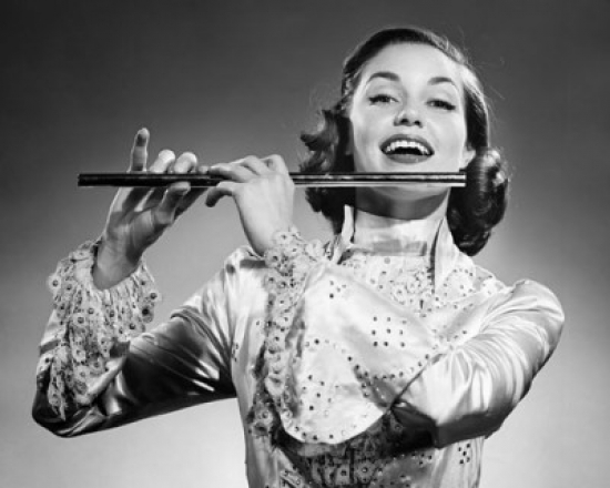 Young Woman Playing a Flute & Smiling Poster Print