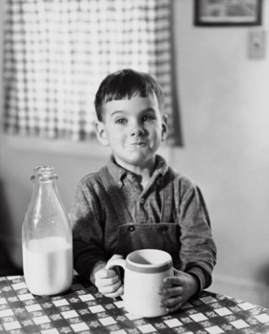 Boy Sitting at the Table & Drinking Milk Poster Print - 18 x 24 in.