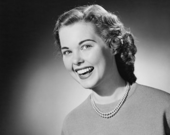 Portrait of a Young Woman Smiling Poster Print - 18 x 24 in.