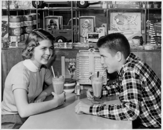 SAL2558611 Side Profile of a Teenage Couple Drinking a Milk Shake in a Restaurant Poster Print - 18 x 24 in.
