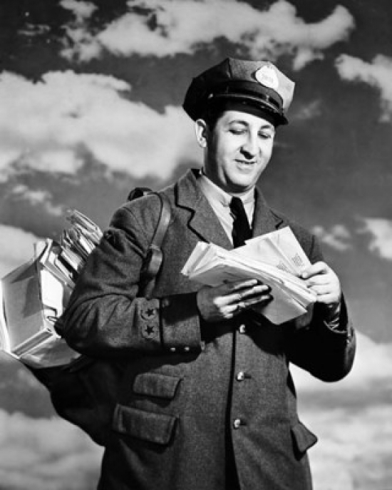 Low Angle View of a Postman Holding Mail Poster Print - 18 x 24 in.