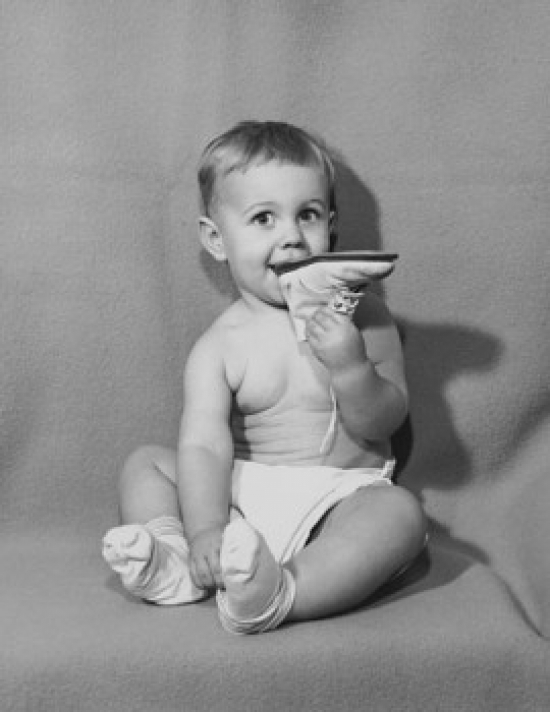 Baby Biting a Shoe Poster Print - 18 x 24 in.