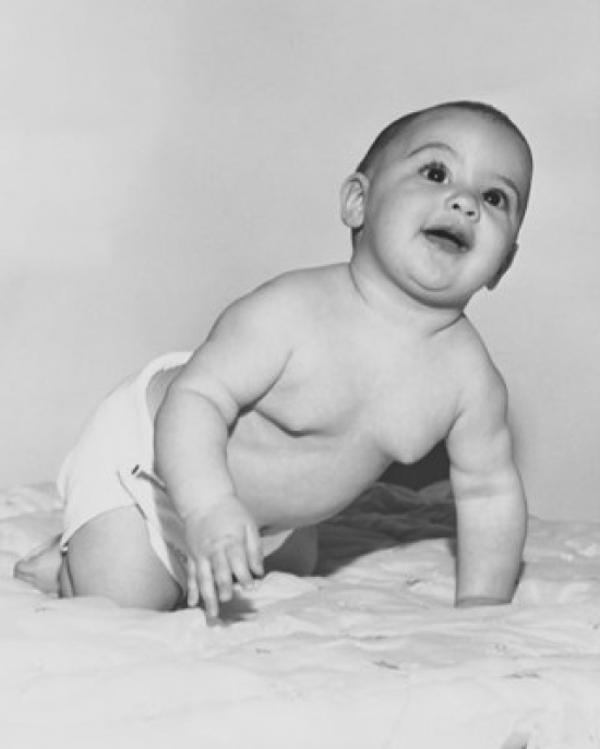 Baby Crawling on the Bed & Smiling Poster Print - 18 x 24 in.