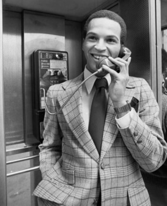 Businessman Talking on a Pay Phone Poster Print - 18 x 24 in.