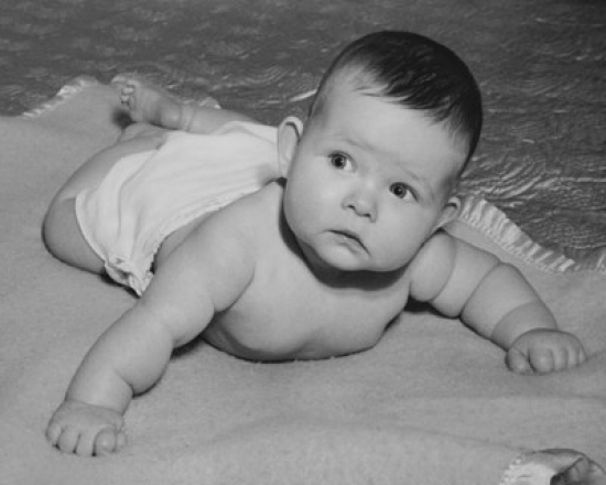 Baby Lying on a Blanket Poster Print - 18 x 24 in.