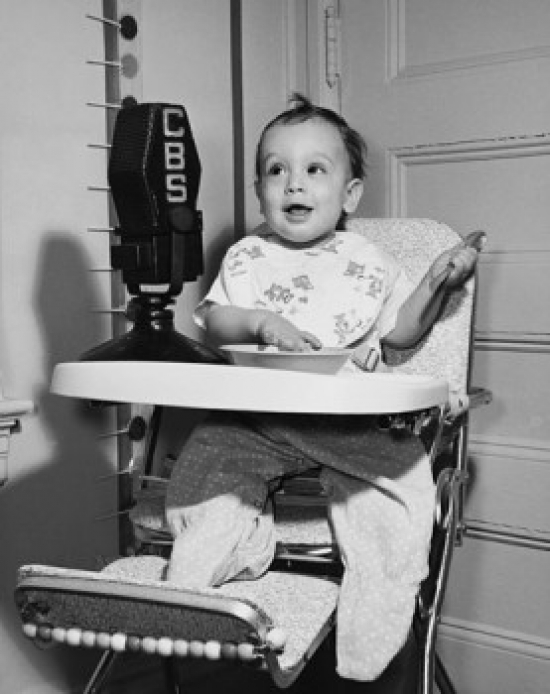 Baby Sitting in a High Chair Poster Print