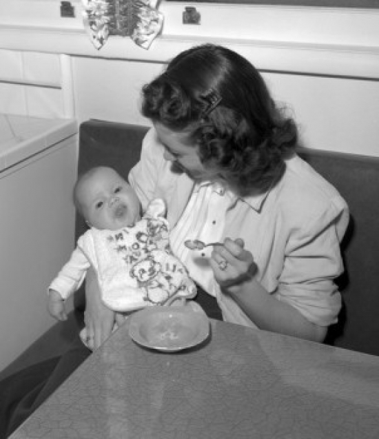 Mother Feeding Baby Poster Print - 18 x 24 in.