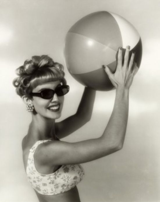Close-Up of a Young Woman Holding a Beach Ball Poster Print - 18 x 24 in.