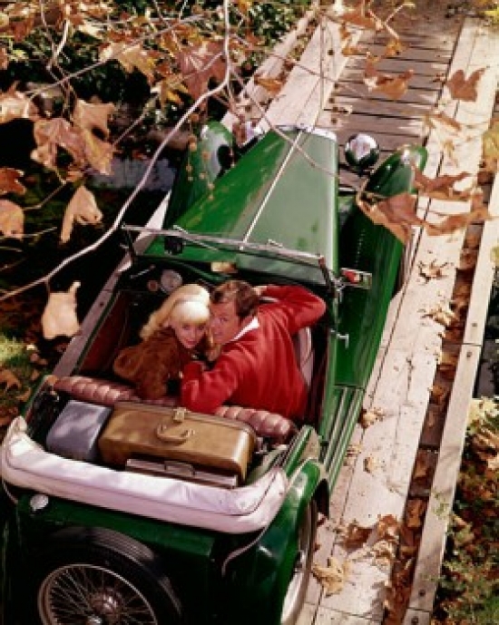 SAL3811362408 High Angle View of a Young Couple Sitting in a Convertible Car Poster Print - 18 x 24 in.