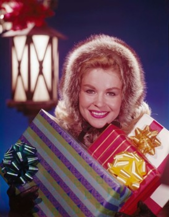Portrait of a Mature Woman Holding Christmas Presents & Smiling Poster Print - 18 x 24 in.