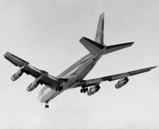 Low Angle View of an Airplane Flying in the Sky Poster Print - 18 x 24 in.