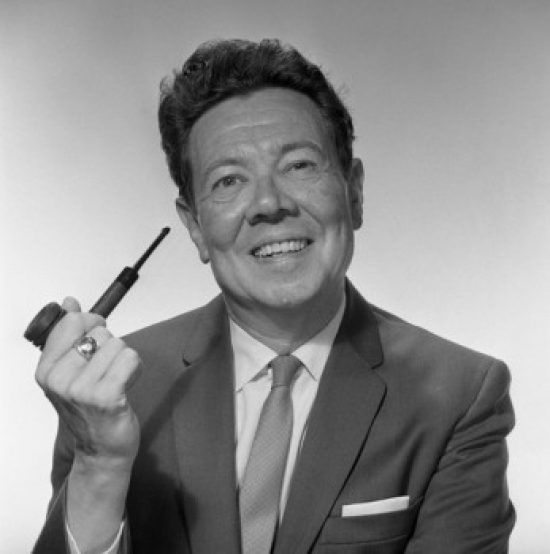 Mature Man Holding Pipe & Smiling Poster Print - 18 x 24 in.