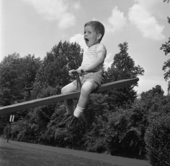 Boy Sitting on Seesaw & Shouting Poster Print - 18 x 24 in.