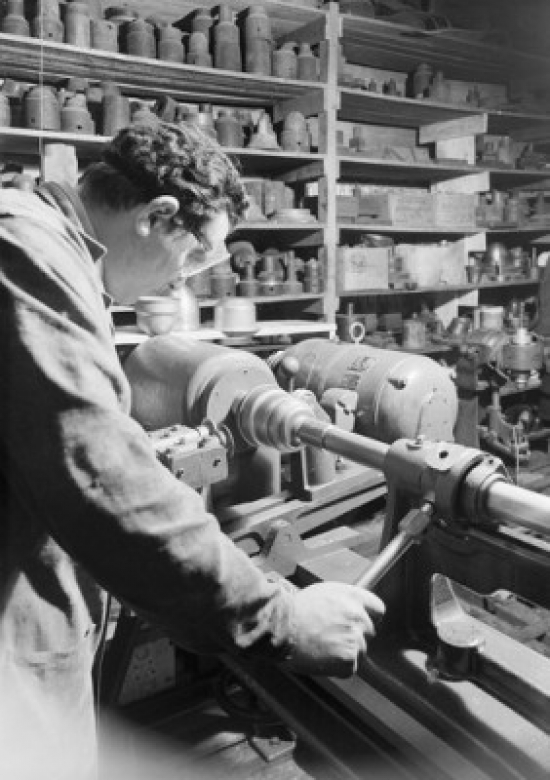 Craftsman Using Machine in Workshop Poster Print - 18 x 24 in.