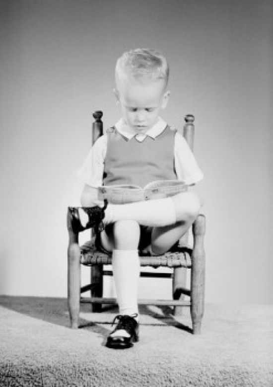 Boy Reading Book Poster Print - 18 x 24 in.