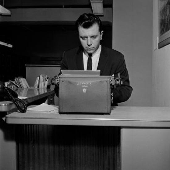 Businessman Typing in Office Environment Poster Print - 18 x 24 in.