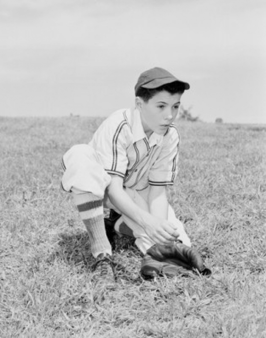 Boy Putting on Baseball Glove Poster Print - 18 x 24 in.