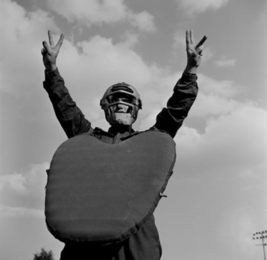 Baseball Player Wearing Helmet & Chest Protector Poster Print - 18 x 24 in.