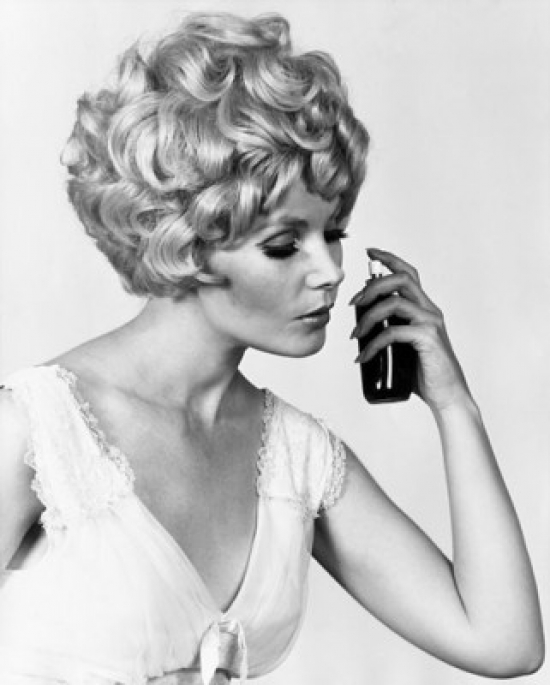 SAL25542541 Close-Up of a Young Woman Smelling Perfume Poster Print - 18 x 24 in.