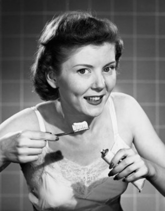 SAL25542555 Portrait of a Young Woman Holding a Toothbrush & Toothpaste Poster Print - 18 x 24 in.