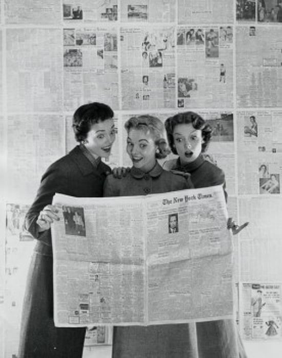Three Young Women Reading a Newspaper Poster Print - 18 x 24 in.