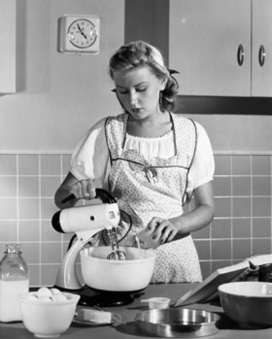 Young Woman Using an Egg Beater in a Domestic Kitchen Poster Print - 18 x 24 in.