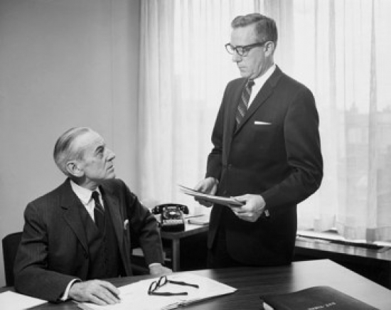 Two Businessmen Talking in Office Poster Print - 18 x 24 in.