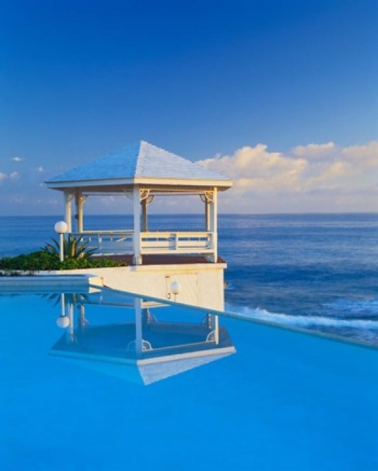 PDDCA05KFO0003 Gazebo Reflecting on Pool with Sea in Background Long Island Bahamas Print by Kent Foster